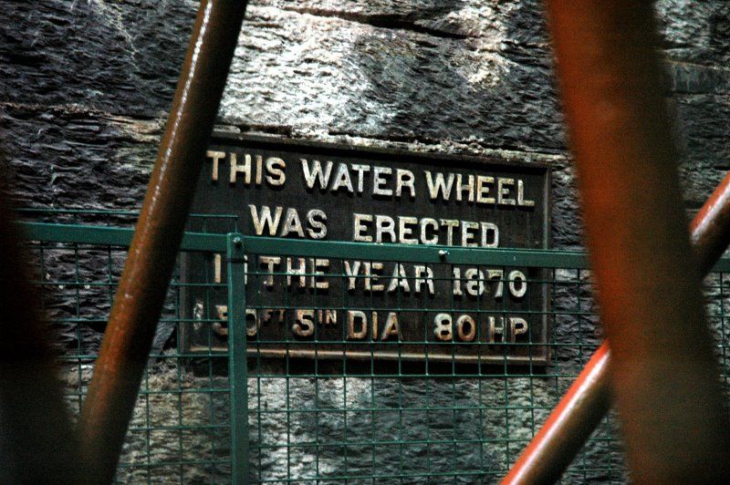 Waterwheel plaque, by Art Patnaude