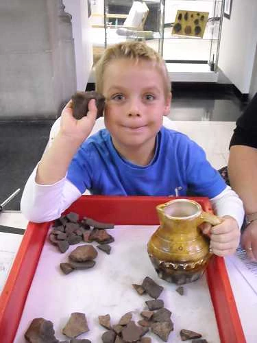 Helping with pottery sorting