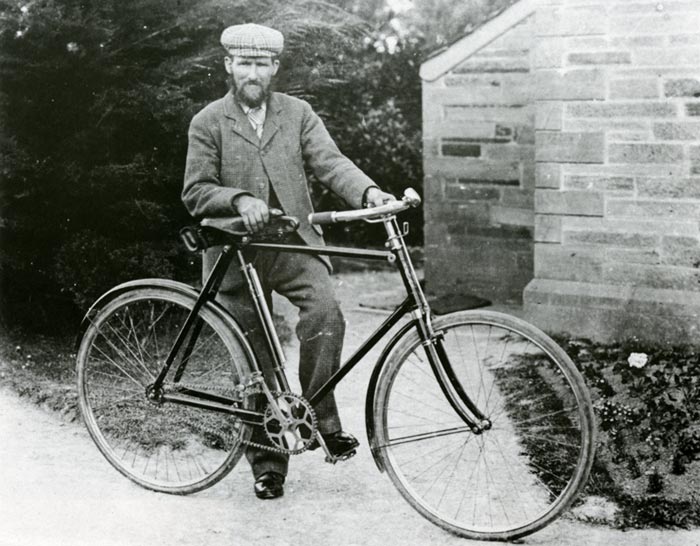 Thomas Daniel posing with his bicycle
