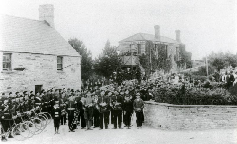 The Band of the Cardigan Volunteer Corps waiting at Cilgerran station to welcome Lt. Colby of Ffynnone home from the Boer War, <em>c.</em>1902