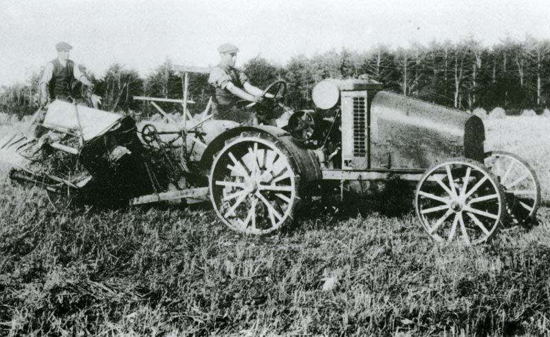 One of the first tractors and corn binders in the district in use at Castle Malgwyn Home Farm