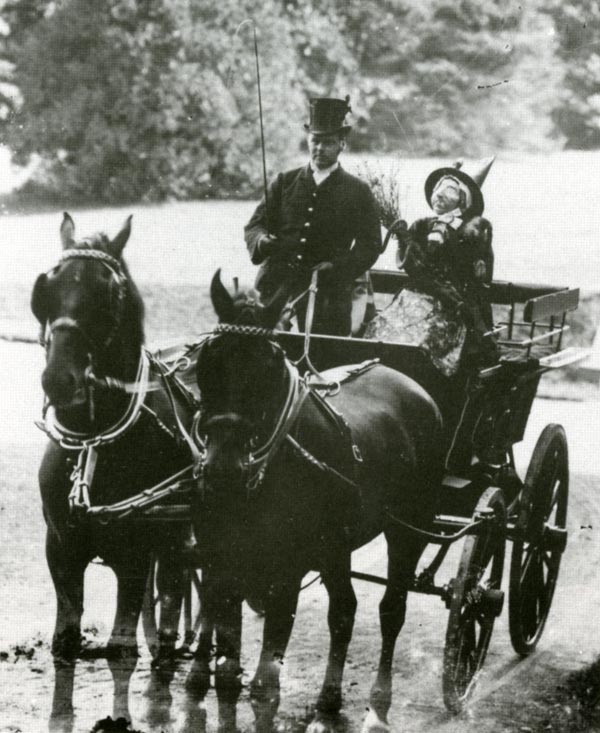 A coachman with an 'unusual' passenger outside Castle Malgwyn